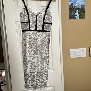 Beautiful brand new black and white lace dress from Express. Size 4. With tags